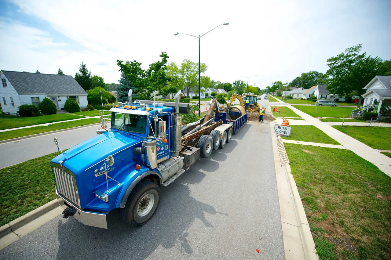 A Bob Frame Plumbing vac truck on a city street